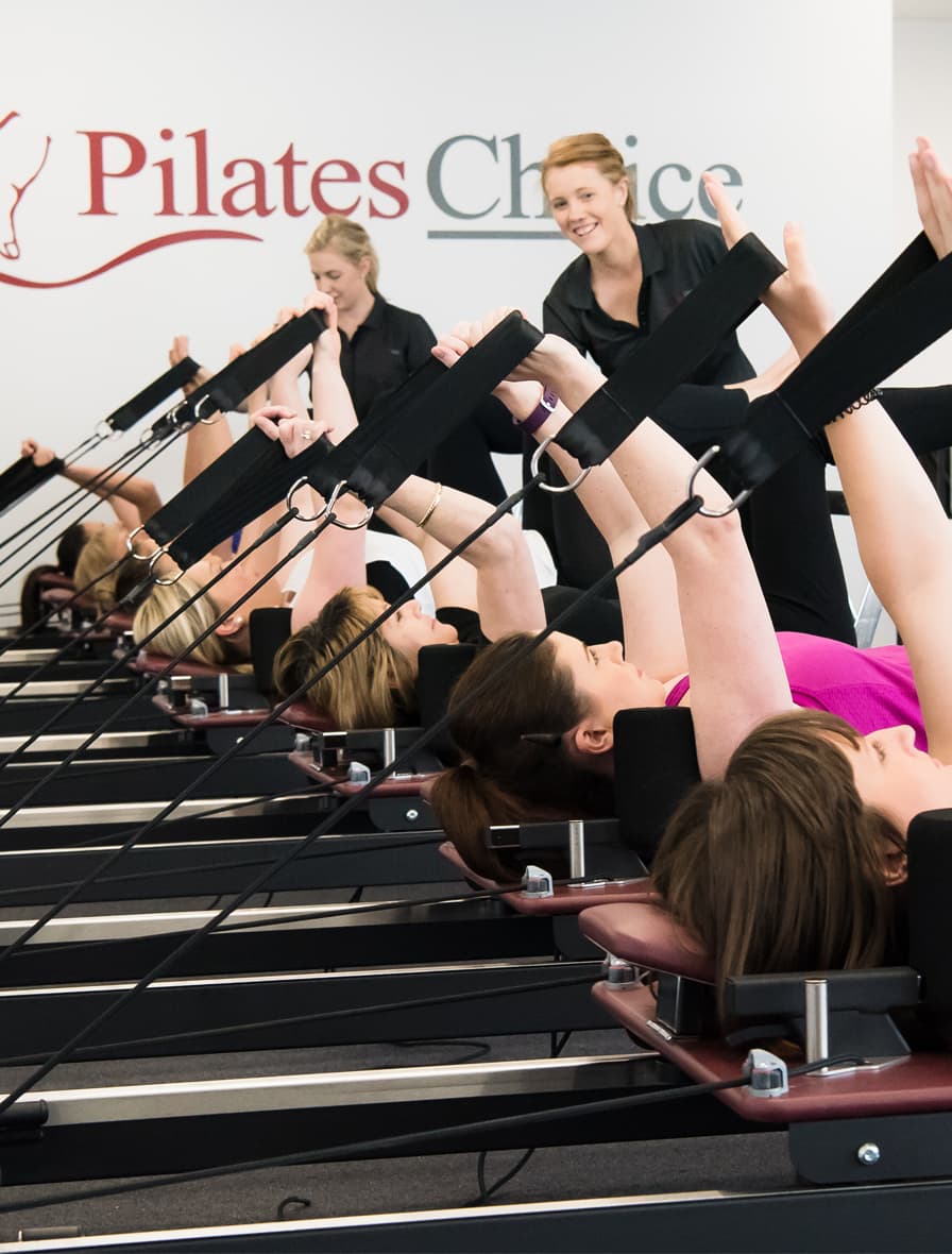 Pilates group doing a synchronized workout