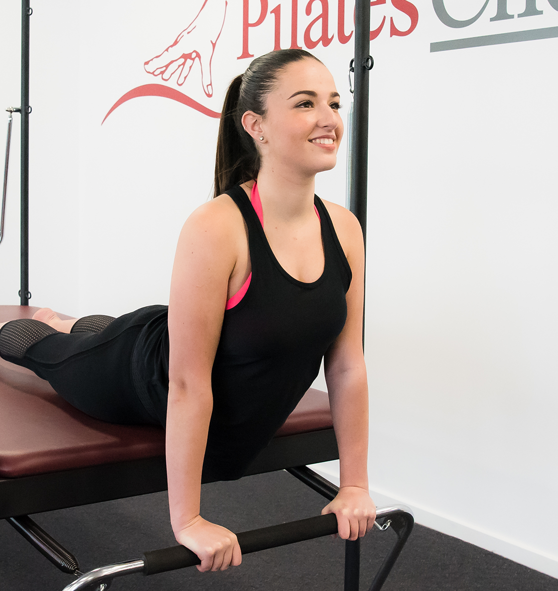woman exercising on a trapeze table